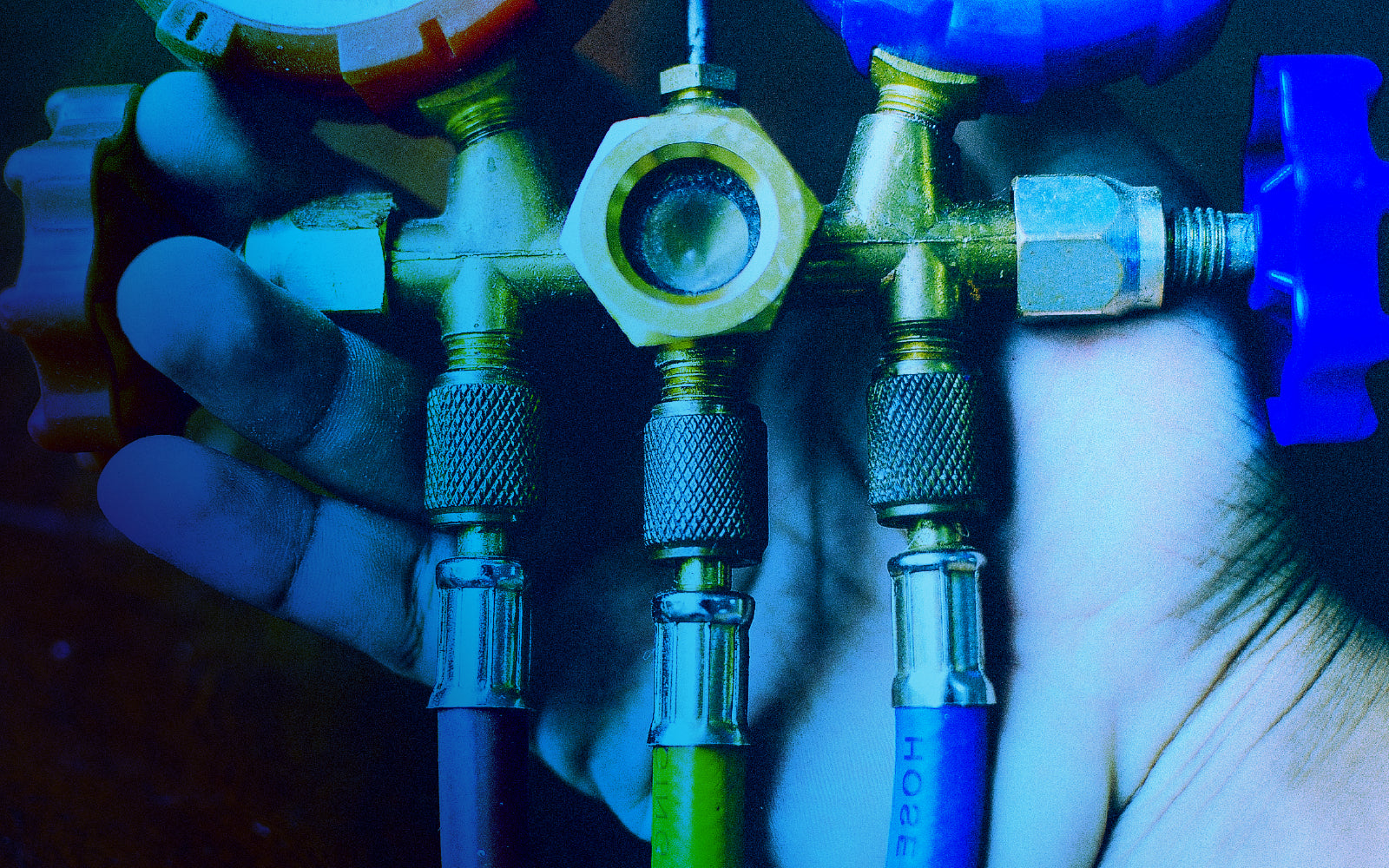 Certified technician conducting backflow testing in a commercial property.